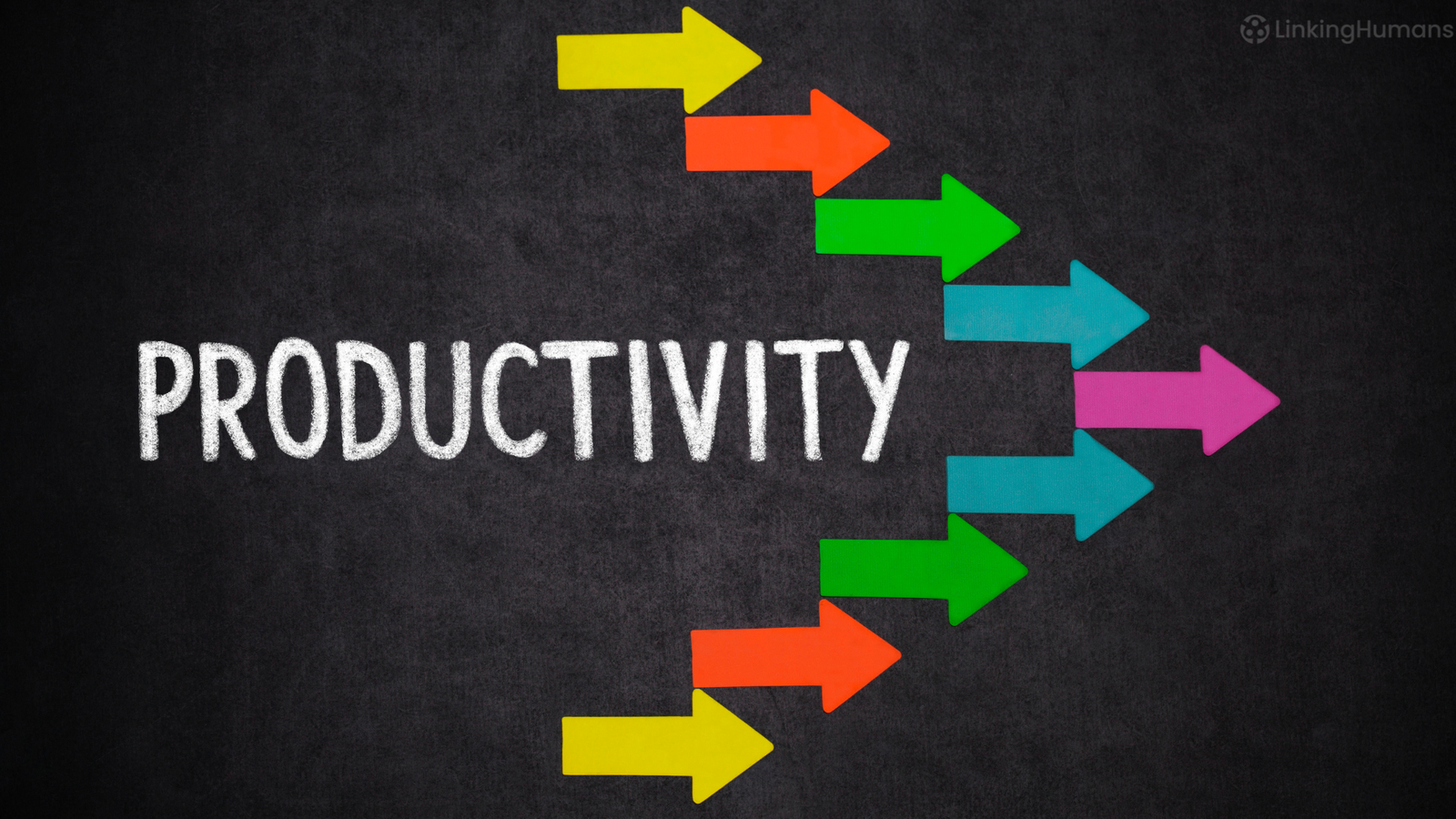 Colourful paper arrows pointing right beside the word "productivity" written in white chalk on a blackboard